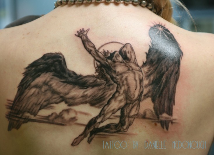 Homemade style black and gray upper back tattoo of falling Icarus