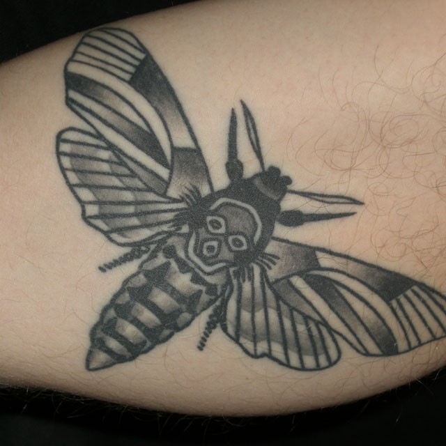 Homemade style black ink leg tattoo of butterfly