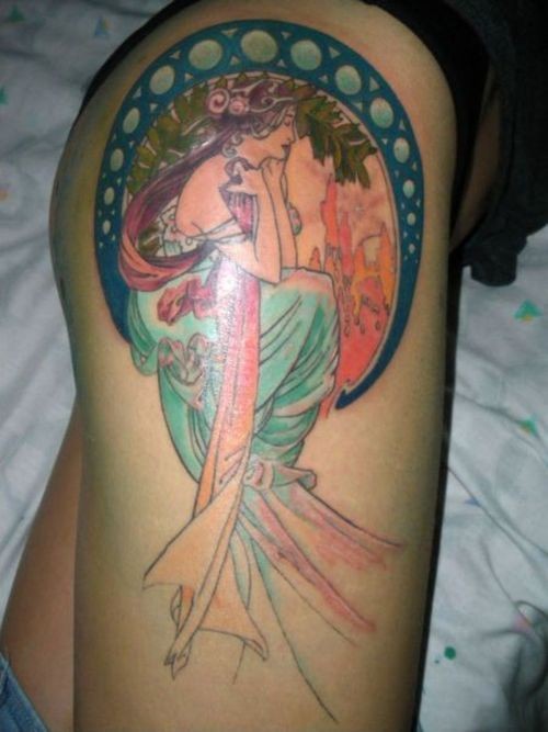Homemade style carelessly painted thigh tattoo of woman portrait