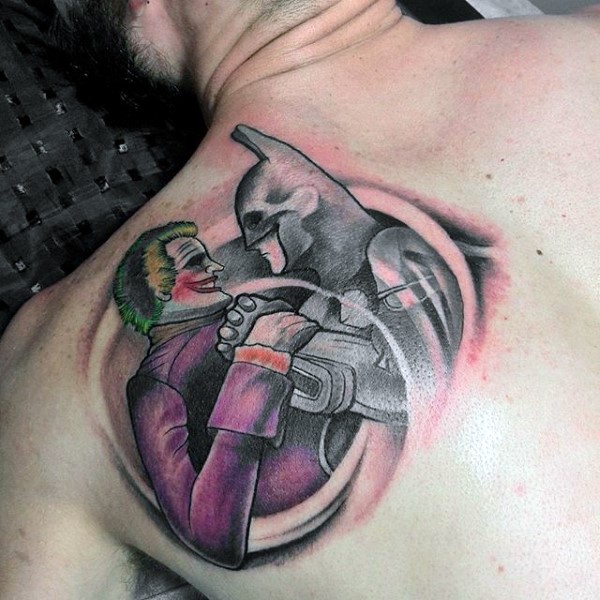 Homemade style colored scapular tattoo of Batman and Joker