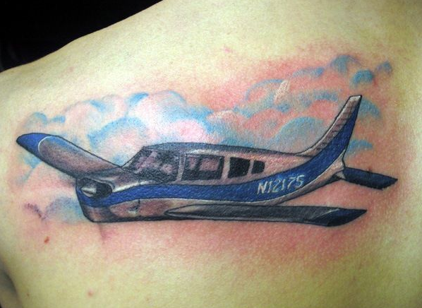 Homemade style colored upper back tattoo of big plane