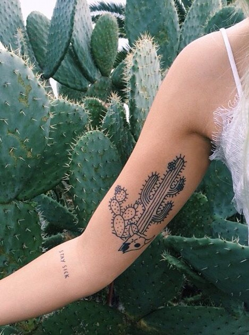 Homemade style painted black ink cactus with animal skull tattoo on arm