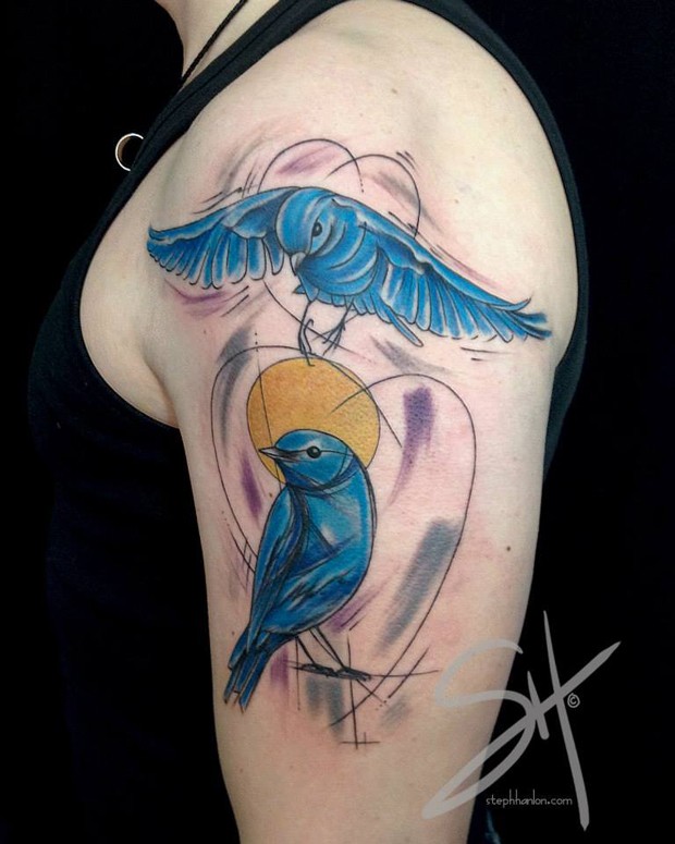 Homemade watercolor shoulder tattoo of blue birds and sun