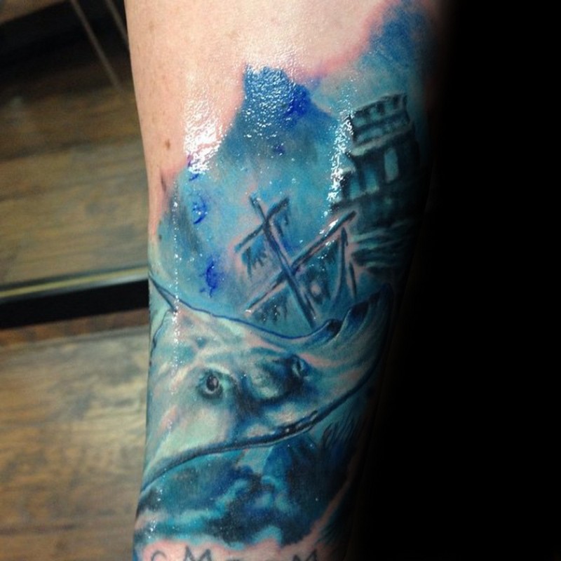 Homemade watercolor style painted arm tattoo of swimming ray and sunken ship