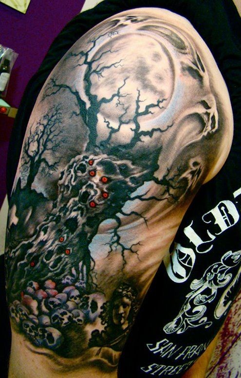Horrible tree death tattoo on arm