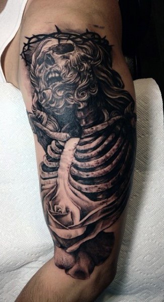 Horrifying black ink Jesus skeleton on shoulder tattoo