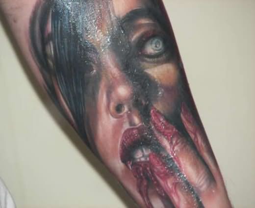 Horror movie like bloody vampire woman tattoo on arm
