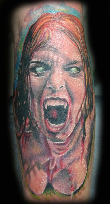 Horror movie like colored leg tattoo of evil bloody vampire woman