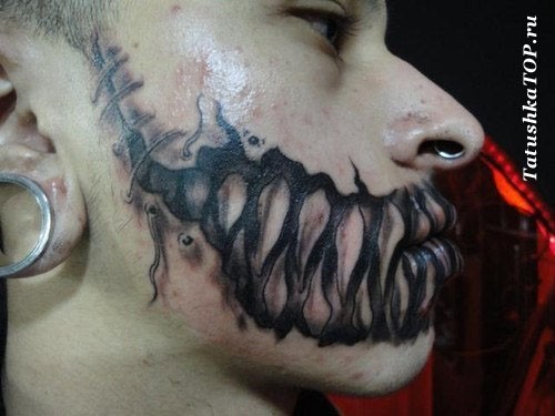 Horror movie style black ink monster teeth tattoo on mouth