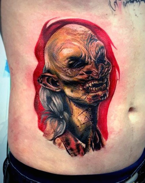 Horror movie style old vampire colored portrait tattoo on belly