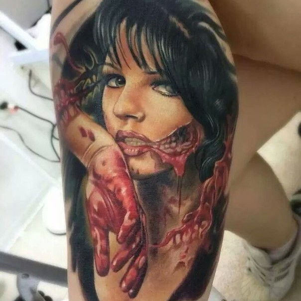 Horror style creepy looking biceps tattoo of zombie woman