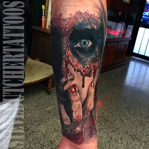 Horror style creepy looking forearm tattoo of creepy woman with mask