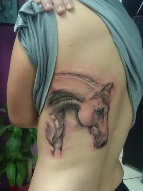 Horse head tattoo on  back