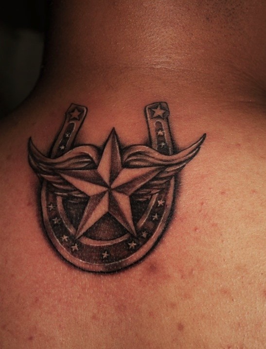 Horseshoe and star with wings tattoo