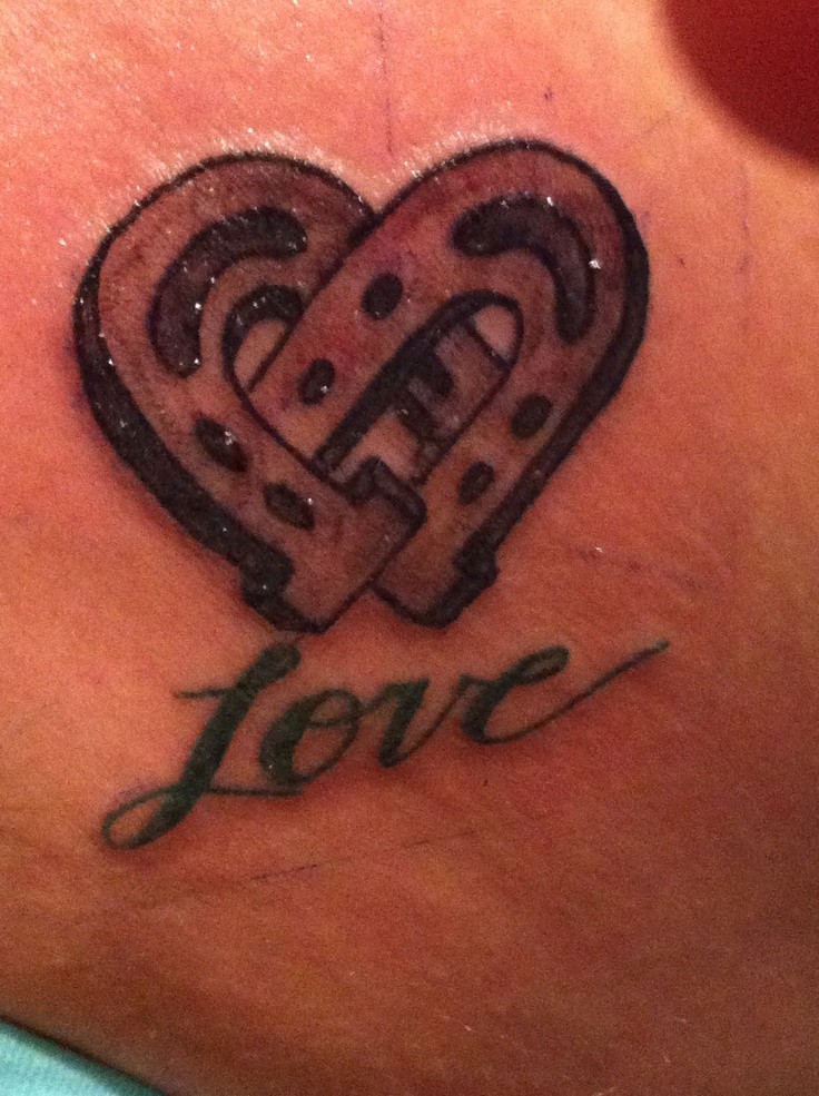 Horseshoe on love and happiness tattoo