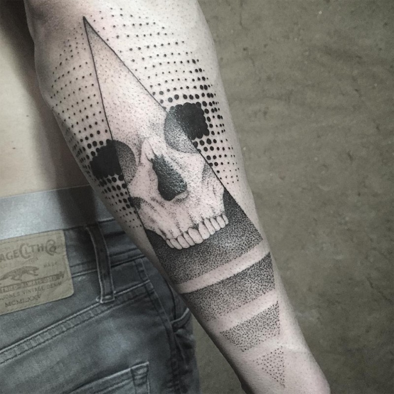 Human skull dotted work forearm tattoo with triangles in geometrical style