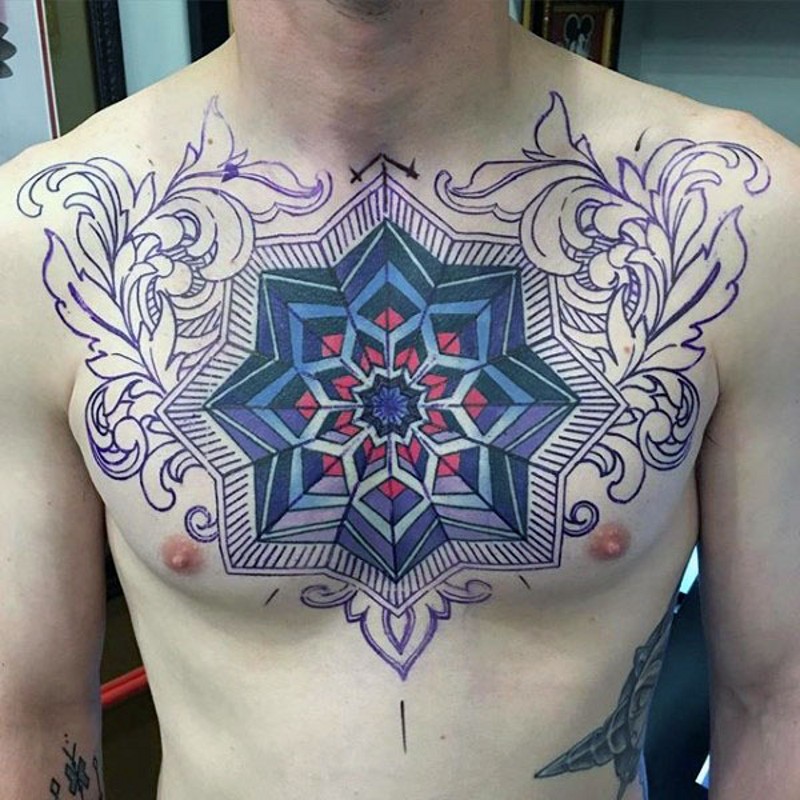 Hypnotic like multicolored ornament tattoo on chest