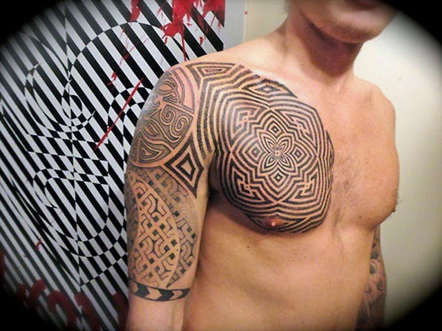 Hypnotic style black ink tribal ornaments tattoo on chest and upper arm