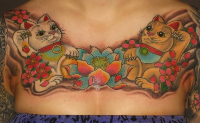 Identical looking colored collarbone tattoo with maneki neko japanese lucky cats and lotus flower