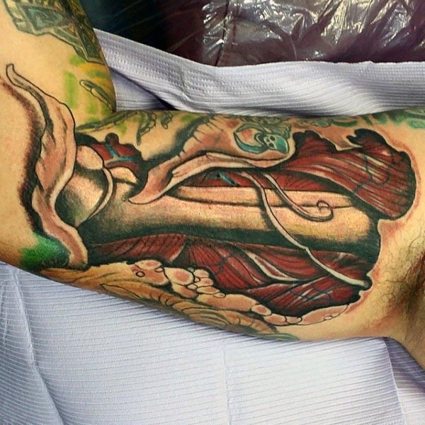 Illustrative colored arm tattoo of human bones and muscles