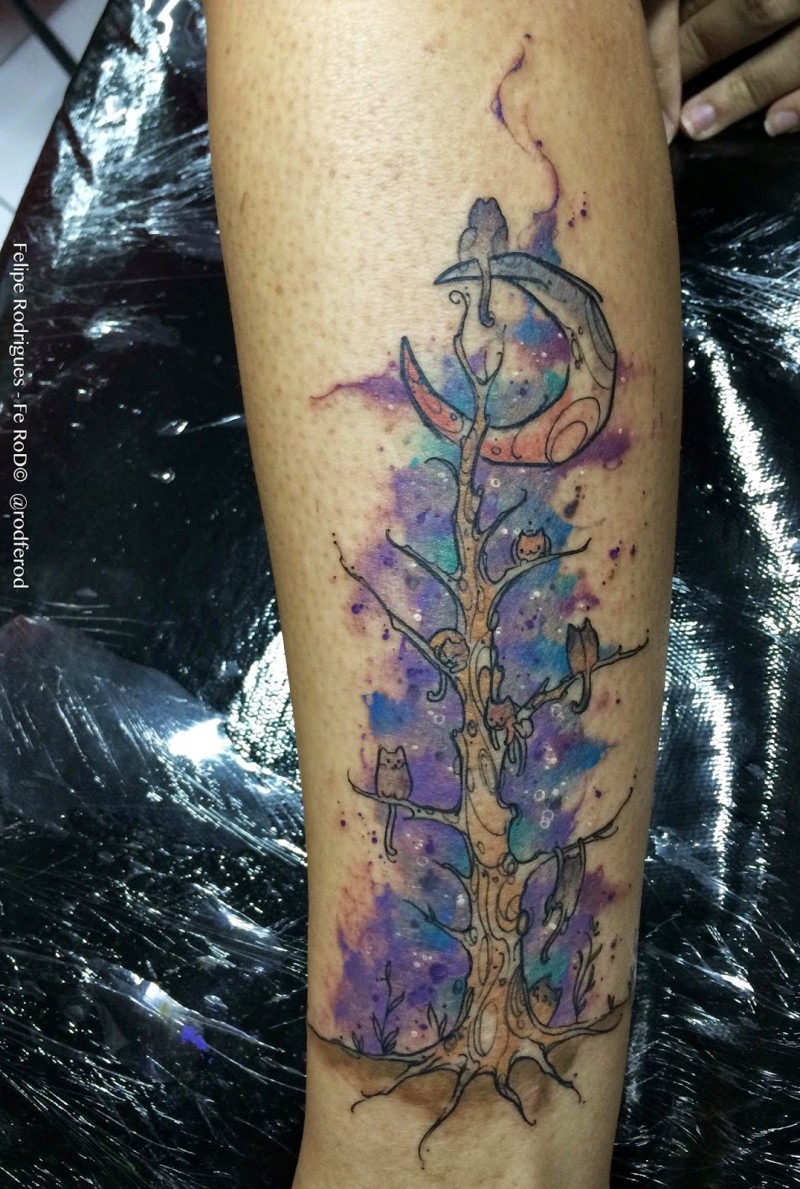 Illustrative style arm tattoo of fantasy tree with moon and cats