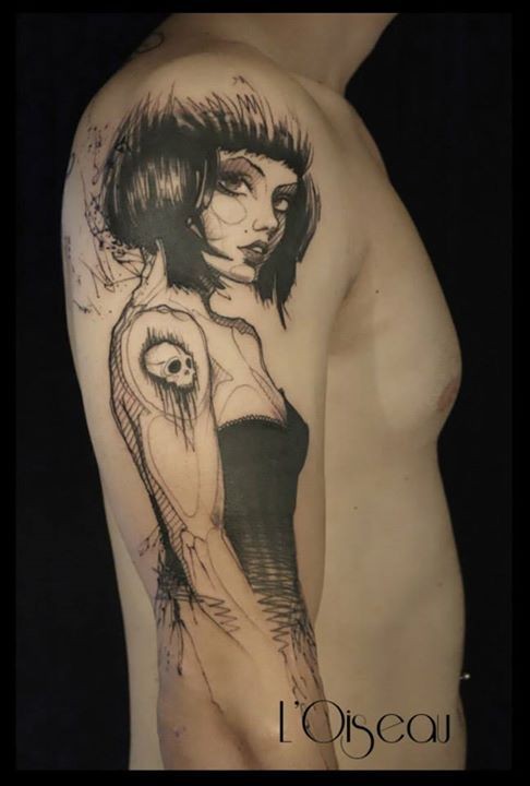 Illustrative style black ink shoulder tattoo of woman stylized with skull