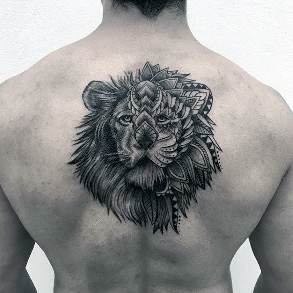 Illustrative style black ink upper back tattoo of lion head stylized with flowers
