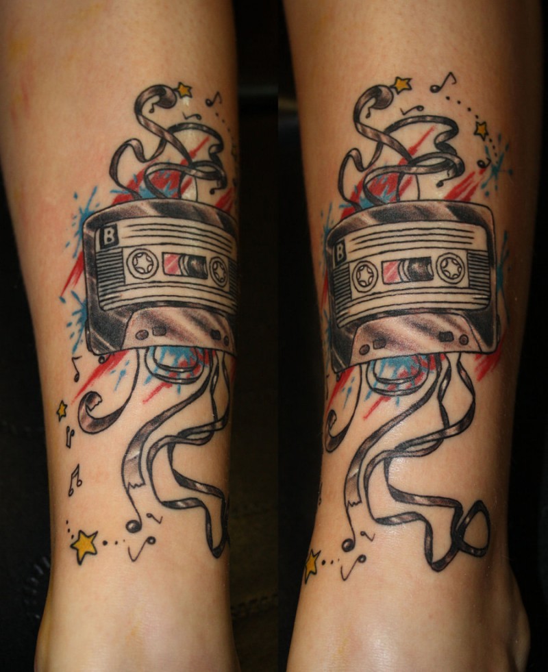 Illustrative style colored ankle tattoo of old music tape