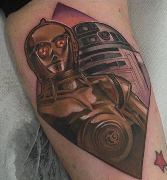 Illustrative style colored arm tattoo of C3PO and R2D2