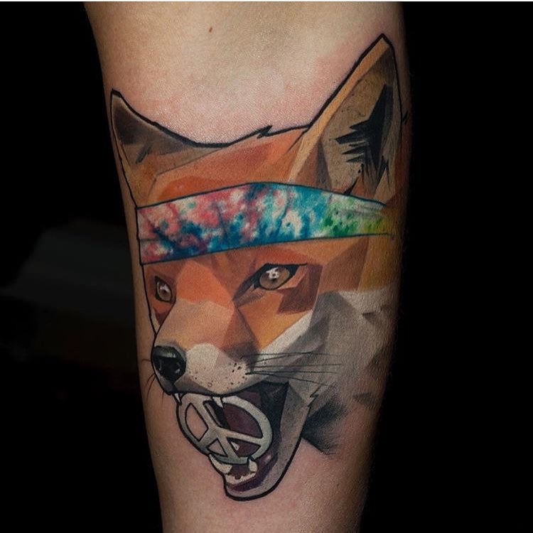 Illustrative style colored arm tattoo of fox with symbol