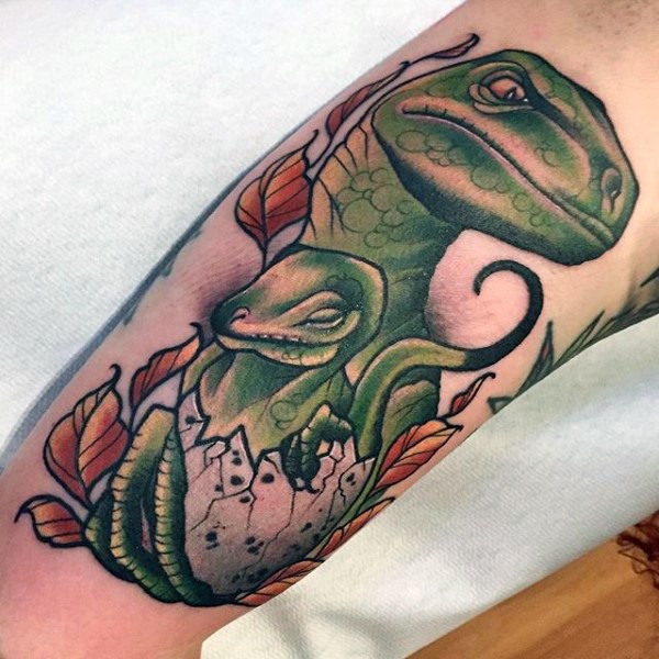 Illustrative style colored arm tattoo of dinosaur family