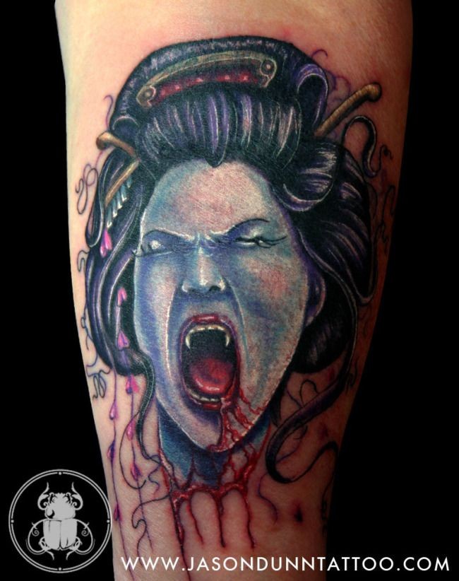 Illustrative style colored arm tattoo of bloody geisha vampire