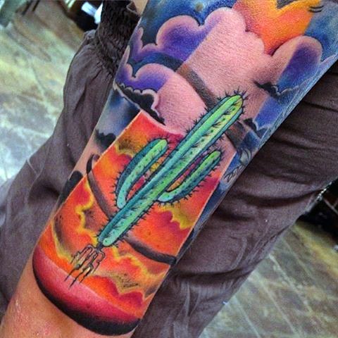 Illustrative style colored arm tattoo of big cactus with clouds