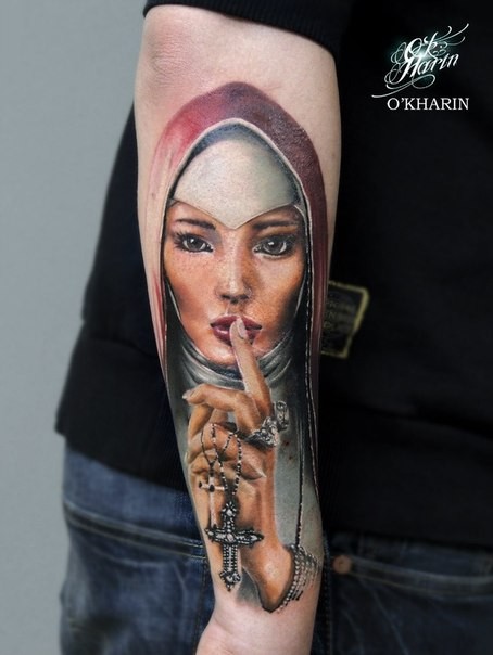 Illustrative style colored arm tattoo of beautiful saint woman with cross