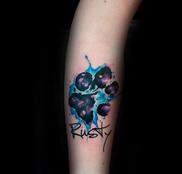 Illustrative style colored arm tattoo of animal paw with lettering