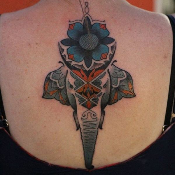 Illustrative style colored back tattoo of saint elephant with flowers