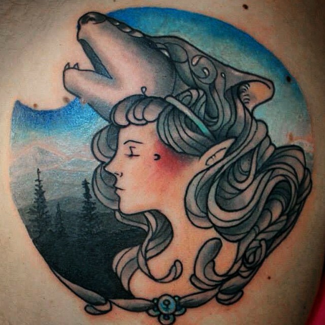 Illustrative style colored back tattoo of woman with wolf and forest