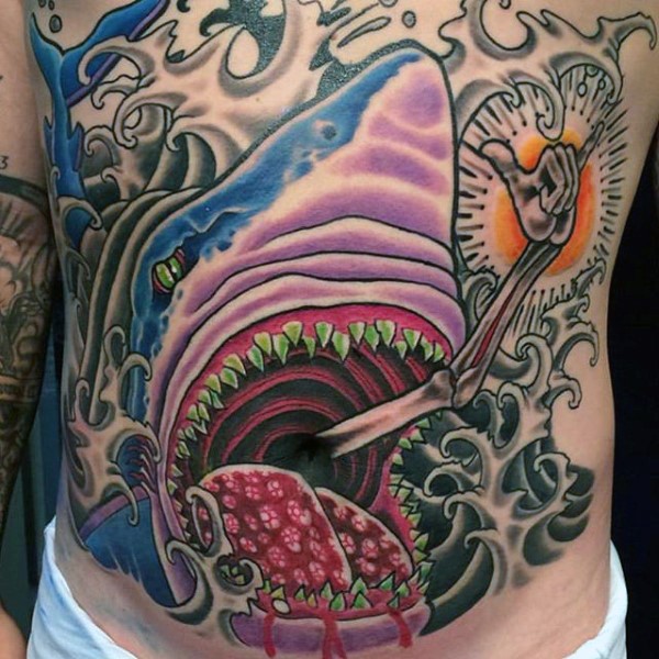Illustrative style colored belly tattoo of mystical shark and skeleton hand