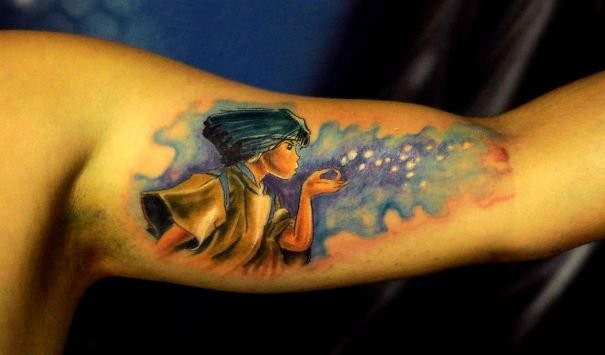 Illustrative style colored biceps tattoo of cool looking man