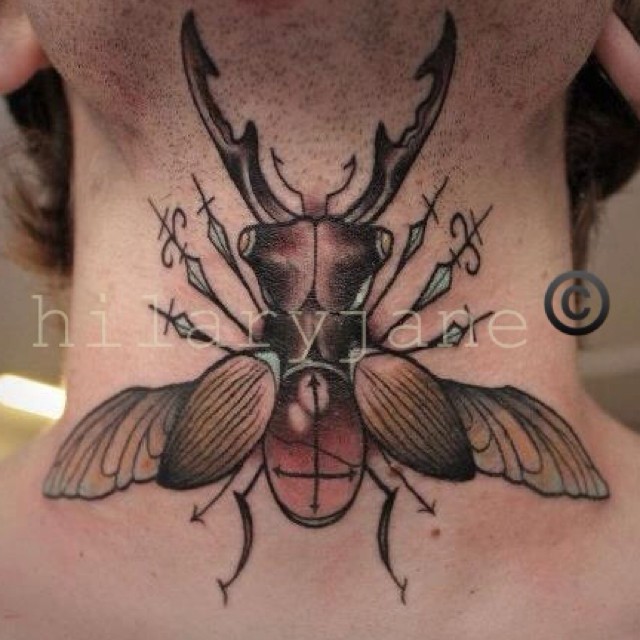 Illustrative style colored big bug tattoo on neck