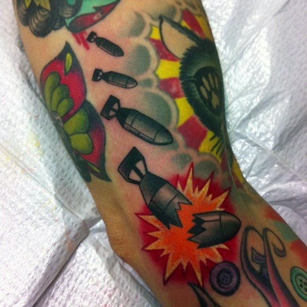 Illustrative style colored bombs tattoo of small bombs