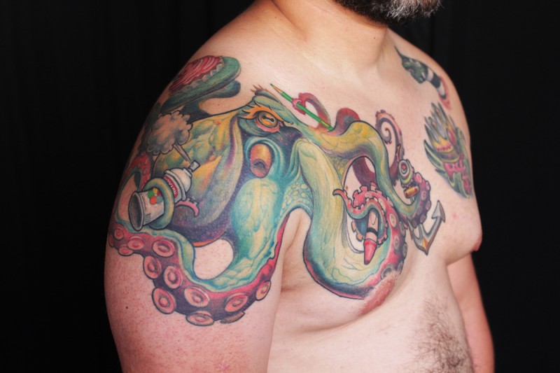 Illustrative style colored chest and shoulder tattoo of cool octopus