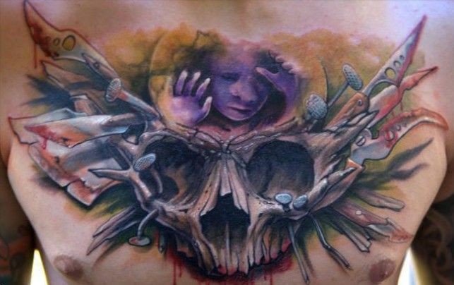 Illustrative style colored chest tattoo of human skull with bloody axes
