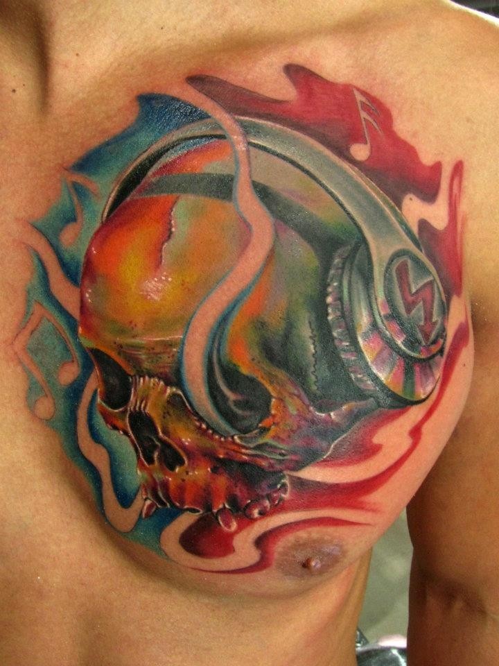 Illustrative style colored chest tattoo of human skull with headset