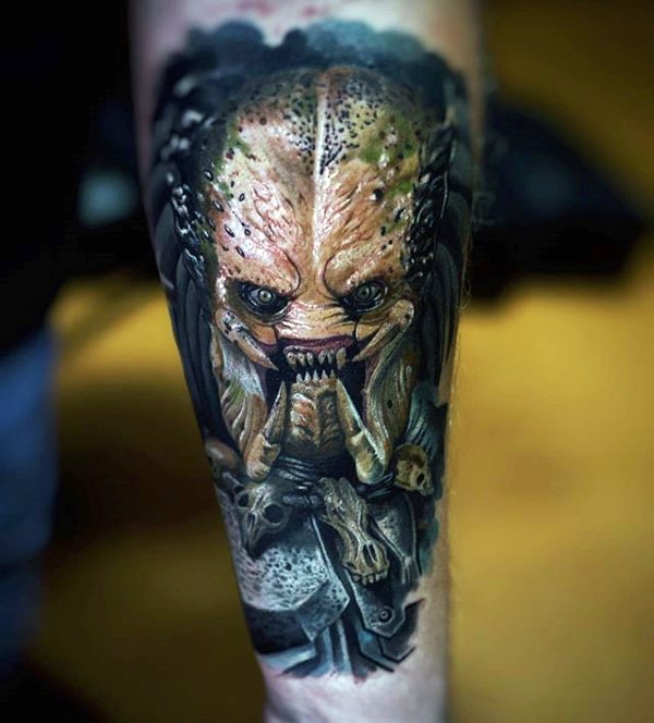 Illustrative style colored forearm tattoo of evil Predator