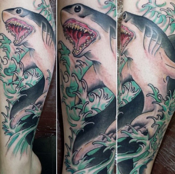 Illustrative style colored forearm tattoo of big shark in waves