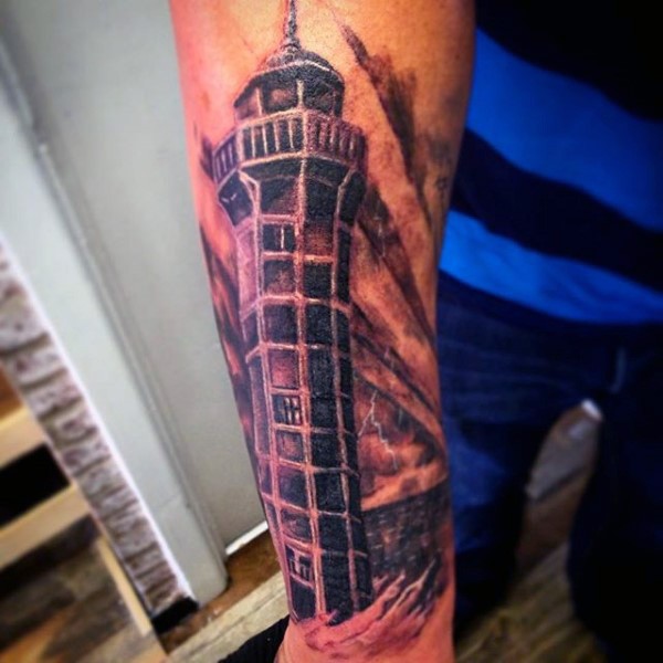 Illustrative style colored forearm tattoo of mystical lighthouse