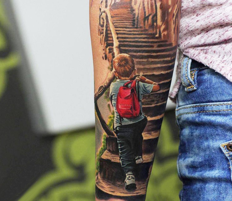 Illustrative style colored forearm tattoo of little boy walking up the stairs
