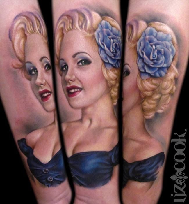 Illustrative style colored forearm tattoo of cute woman with blue flower