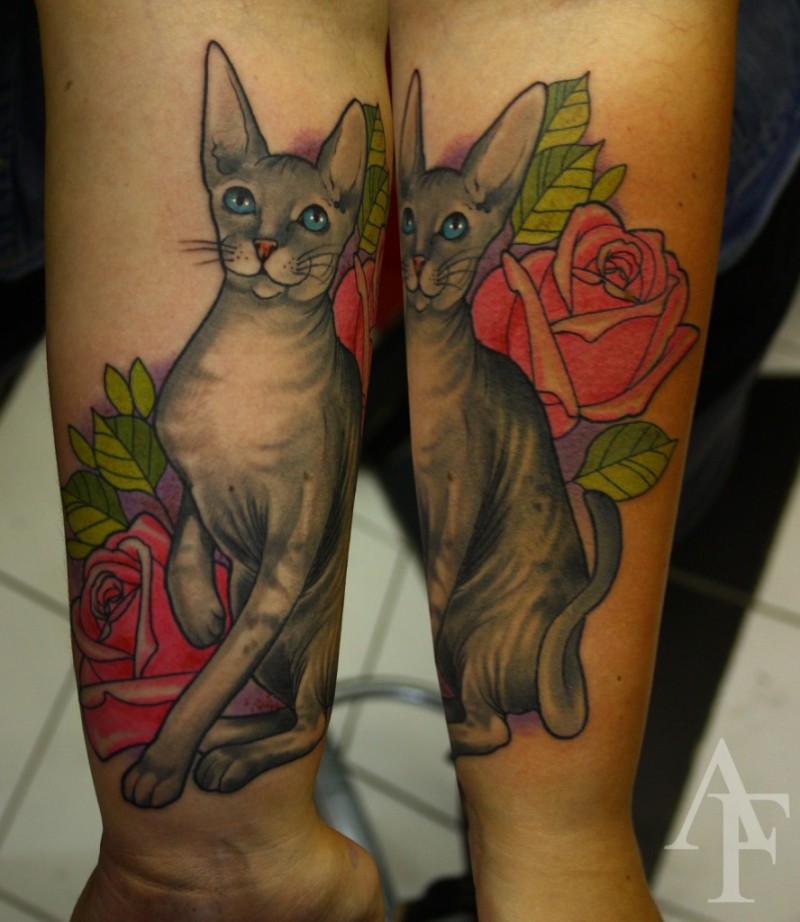 Illustrative style colored forearm tattoo of cat with rose and leaves